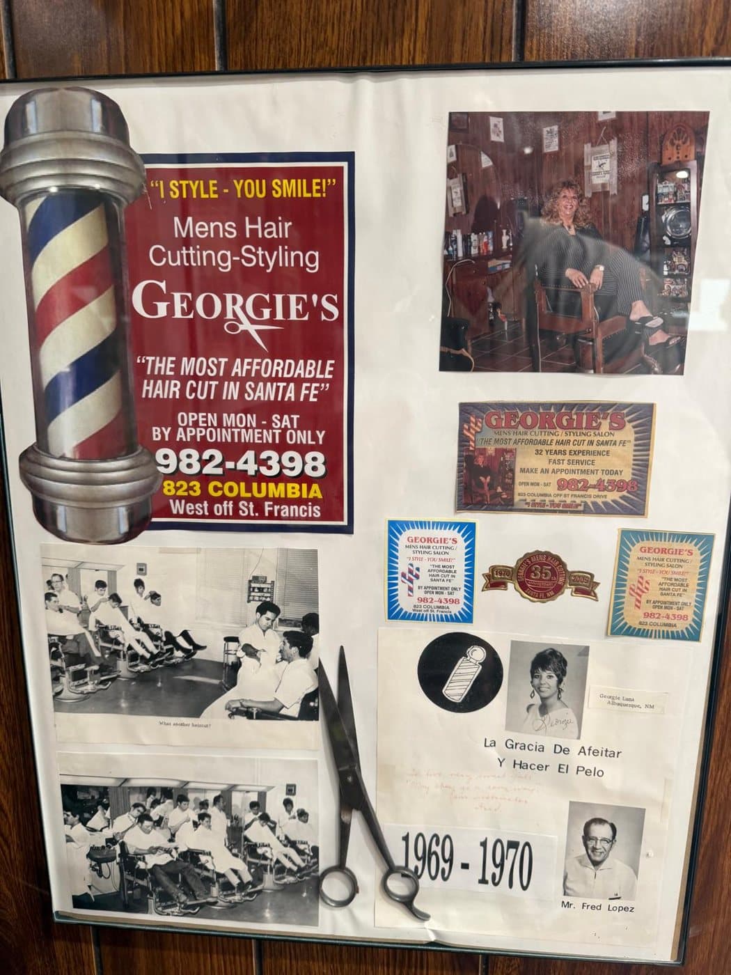 Framed board from the shop wall: Georgie's early ads, her 1969–1970 Barbers' College photos and class pictures