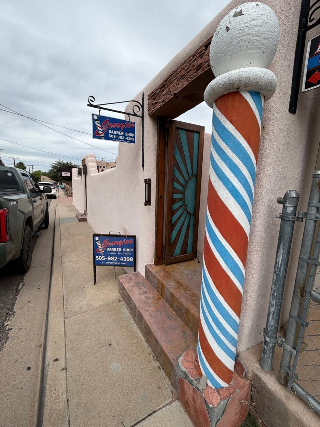 The barber pole outside Georgie's adobe shop on Columbia Street